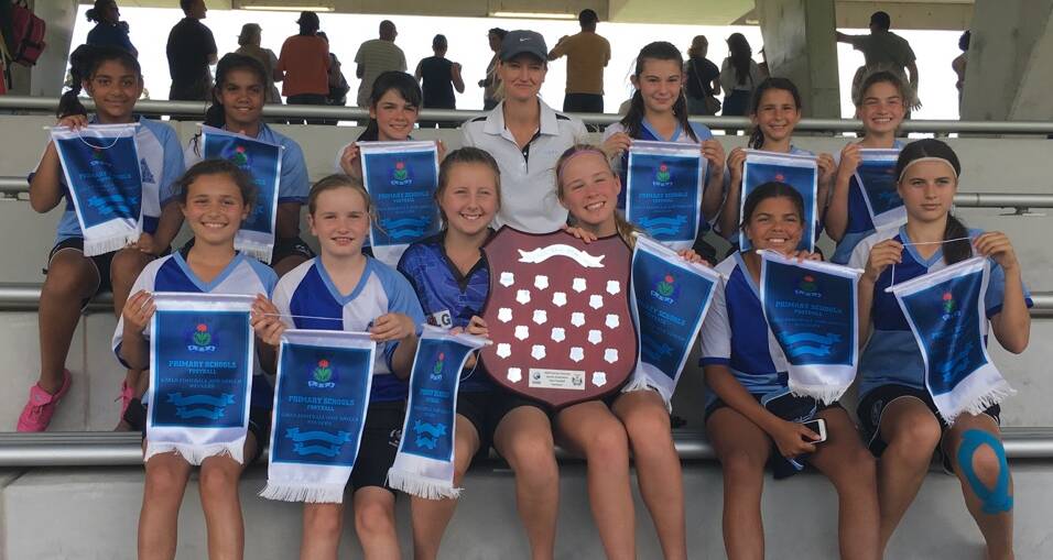 TRIUMPH: Griffith East Public School girls' football team coach Sharon Careri and her players after their win at the NSW PSSA Knockout. Picture: Supplied
