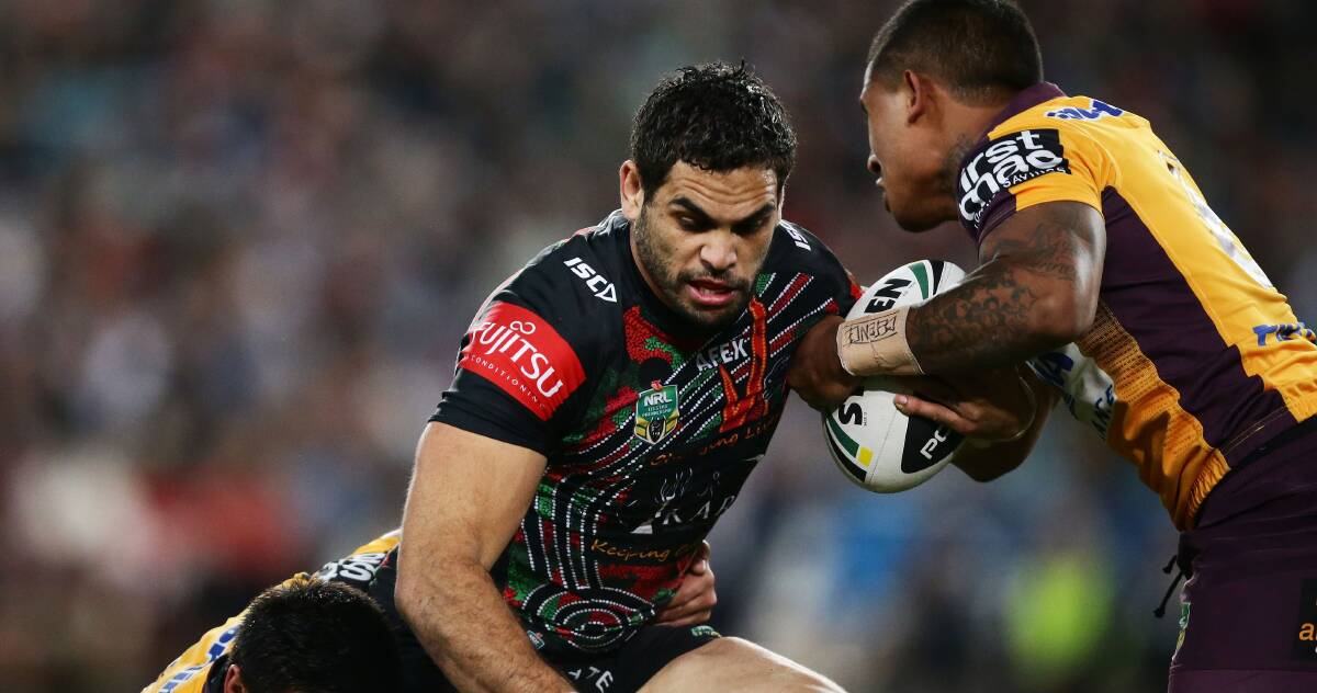 COLLISION COURSE: Rabbitohs star Greg Inglis is tackled by Broncos players. The clubs open the 2015 NRL season on Thursday. Picture: Getty Images