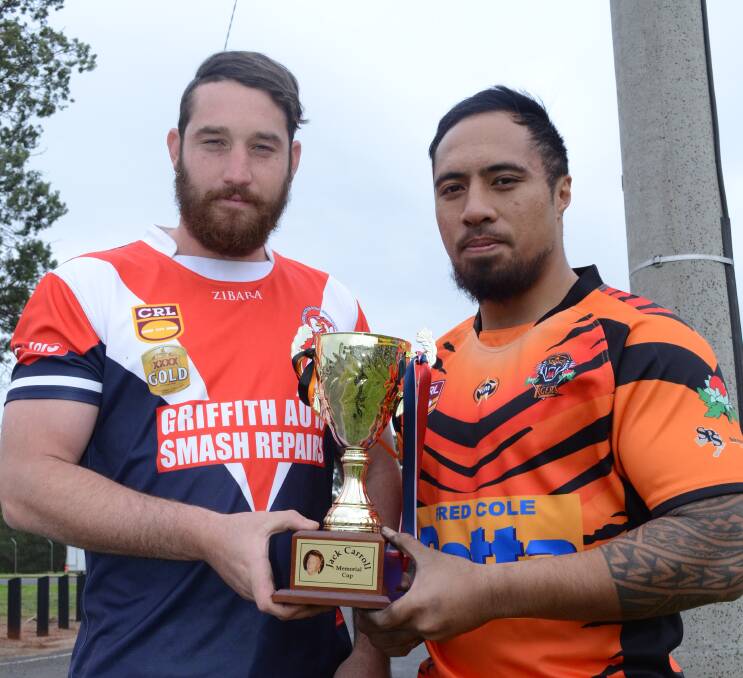 ALWAYS REMEMBERED: Darlington Point-Coleambally's Dillon Bartter (left) and Griffith Waratahs' Kose Lelei with the Jack Carroll Memorial Cup. Picture: Andrew Piva 