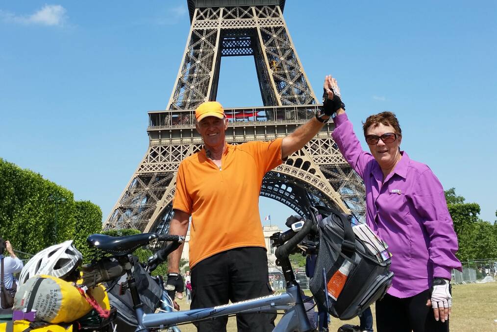 ON THE ROAD: Grant and Joan McKern at the Eiffel Tower in Paris. They cycled about 3200 kilometres through Europe. Picture: Supplied.