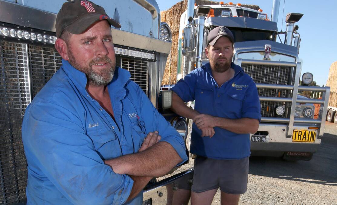 FRUSTRATED: Michael Domjahn and Jeremy Horne in Hillston. Mr Horne said the Prime Minister's announcement is just another part of a saga. Picture: Anthony Stipo.