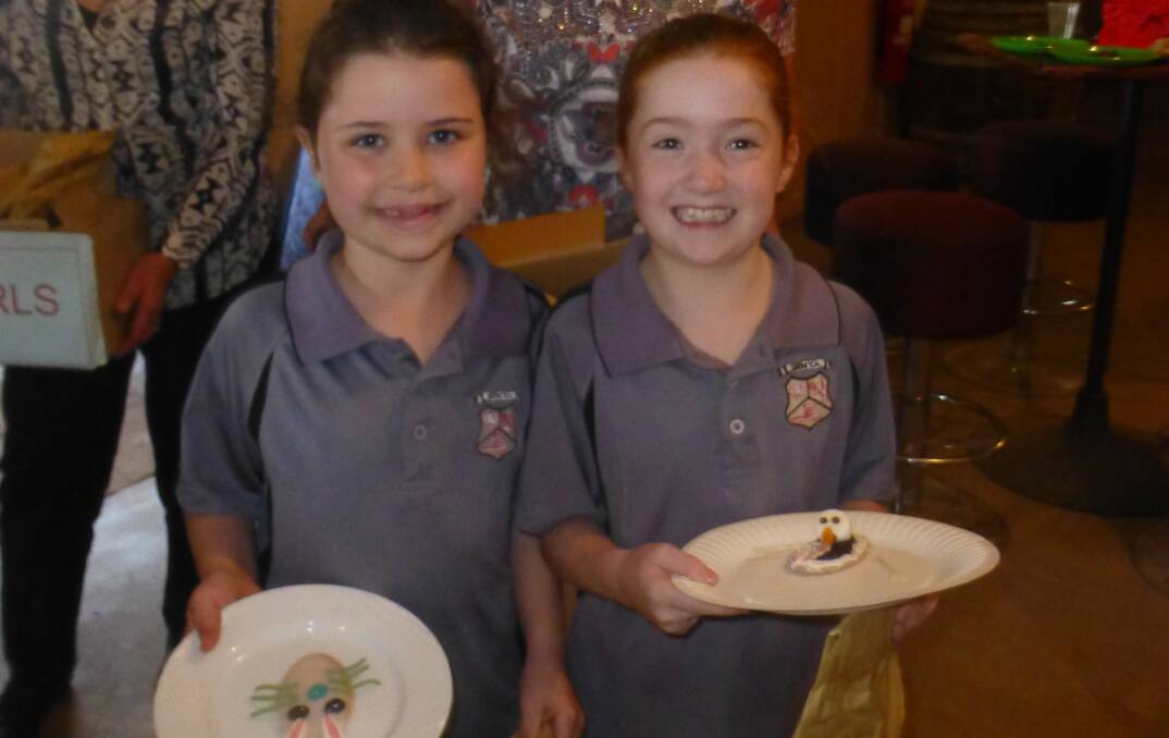 Emily Forster and Claire Burcham with their winning entries in the Decorated Arrowroot Biscuit.