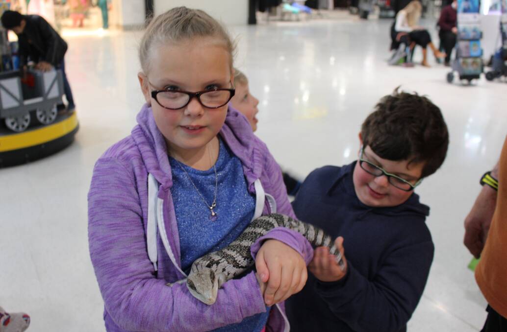 Gracey Chenall, 9, and Phillip Maugeri, 7 couldn't wait to hold the animals.