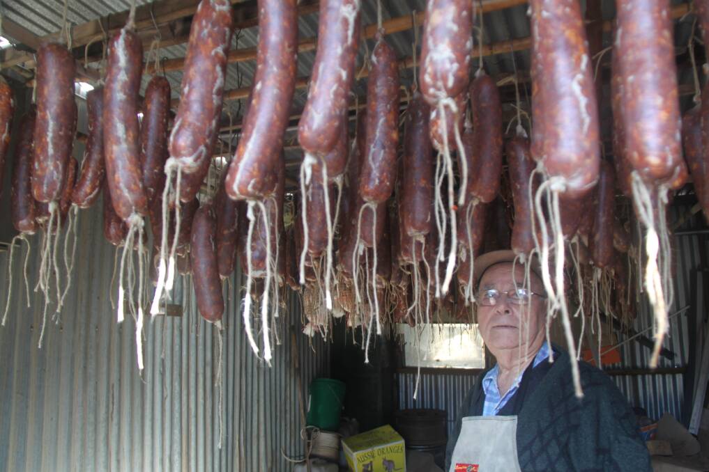 CURE: Vincenzo checks the salami is curing properly. Picture: Stephen Mudd.