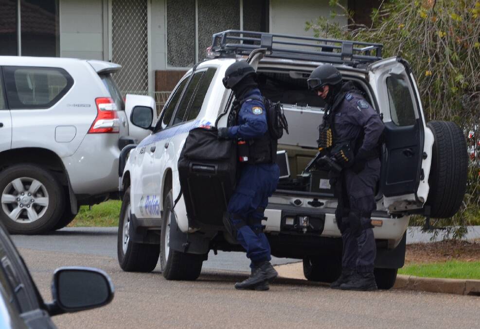 SIEGE: Tactical SPSU unit is on site and ready to assist. Picture: Stephen Mudd