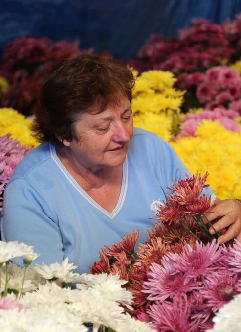 FLOWERS: Santa Portolesi and her beautiful flowers. Picture: Anthony Stipo.
