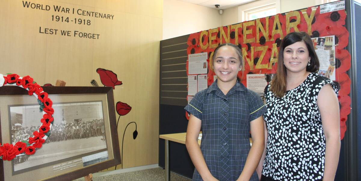 GO-GETTER: Andria Zanotto, 14, with her mentor Laura Tagliapietra in front of the display they created at the library. The pair met through the Youth Frontiers Mentoring Program. Picture: Stephen Mudd.