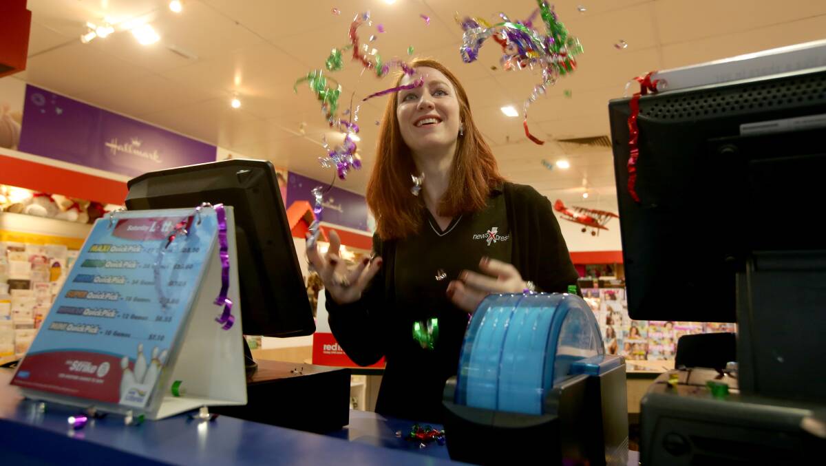PARTY TIME: Emma Hardie from Griffin Plaza Newsagency celebrates the outlet's double jackpot win. Picture: Anthony Stipo.