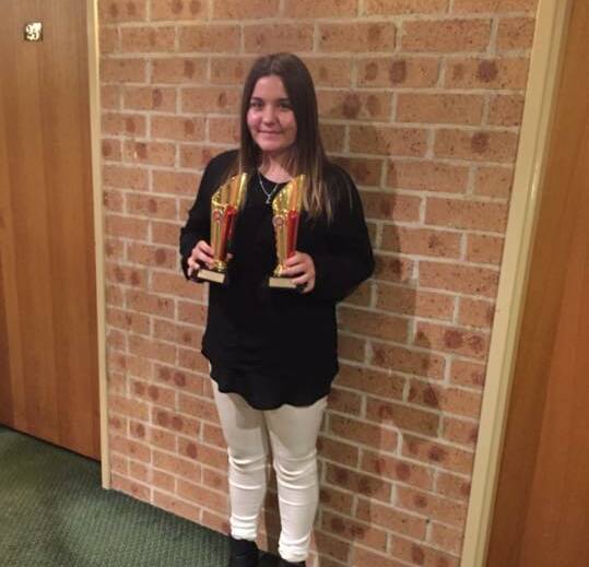 WINNER: Lara Camm with her two awards from the Macarthur Country Music Club Talent Quest. Picture: Supplied.