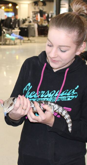 Kamarah Hutchins, 18, with 'Bluey' the blue tongue lizard.