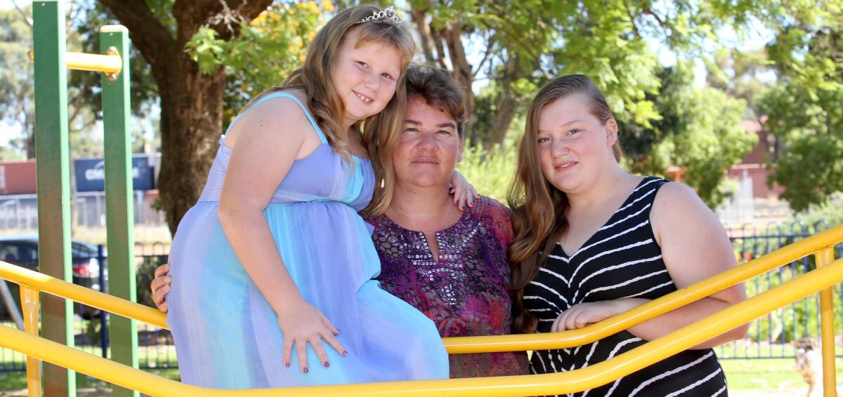 RECOVERY: Mia Richards with daughters Chloe, 10 and Caitlin, 17. They will tackle the City2Lake in March as part of Mia's recovery. Picture: Anthony Stipo.