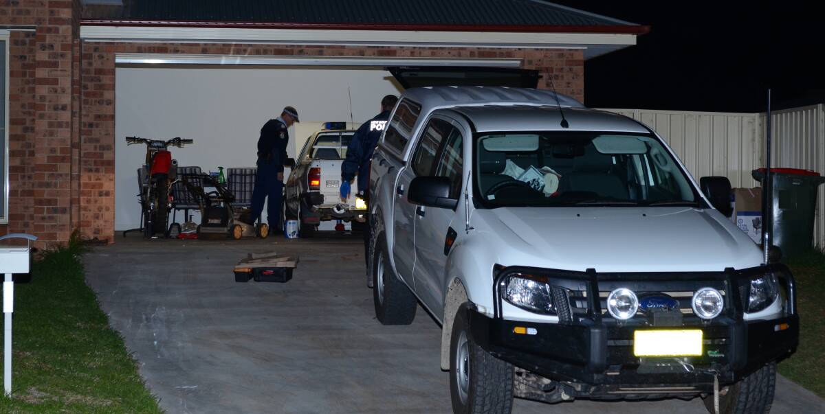 SEARCH: Police search at property at Collina on Friday night following a string of arrests. Picture: Stephen Mudd.