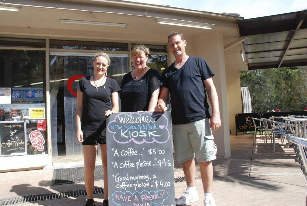 Head chef Megan Jones and owners Kylie Pickett and Kev Chilver with the sign. Photo: Phil McCarroll