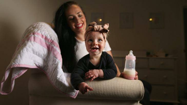 Tara Lloyd feeds her 8-month-old daughter Gracie Perkin a2 Platinum infant formula. Photo: Wayne Taylor