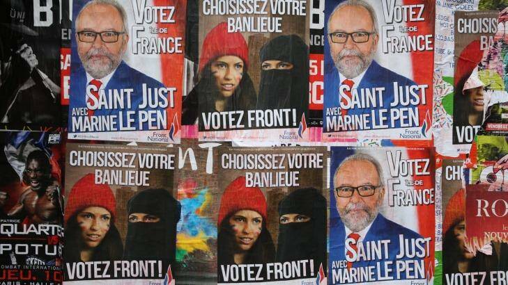 Posters for far right anti-immigration party National Front state in Paris, this month. Photo: Andrew Meares