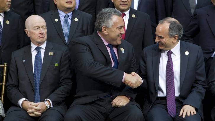 Treasurer Joe Hockey pictured shaking hands with Turkey's Central Bank Governor Erdem Basci before a group photo of G20 finance ministers and central bank governors in Washington last week. Australian Reserve Bank governor Glenn Stevens looks on. Photo: Jose Luis Magana