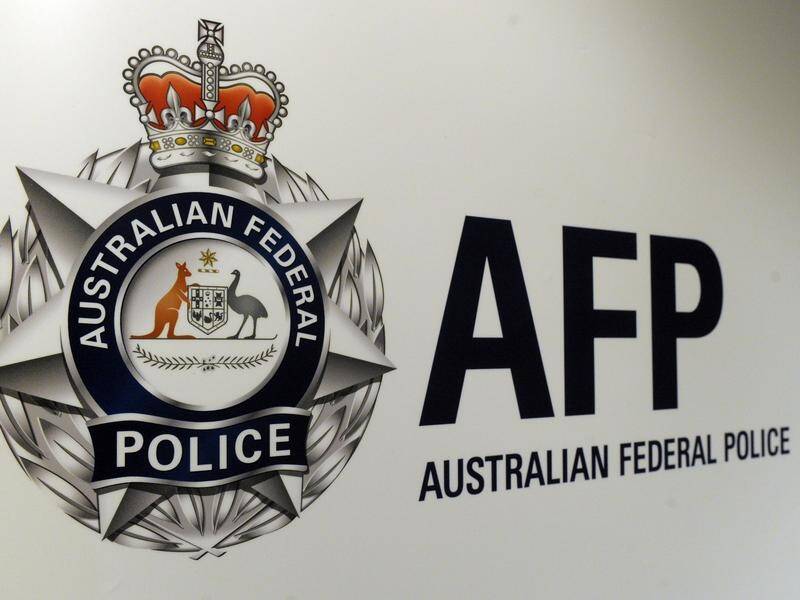 The AFP has charged a Sudanese man for letting his electronic monitoring device go flat. (Julian Smith/AAP PHOTOS)