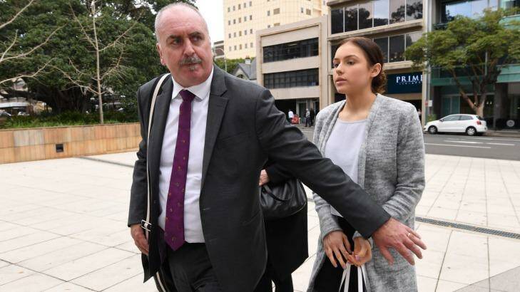 Madeline Sawyer arrives at Parramatta District Court with her lawyers on Thursday. Photo: Peter Rae