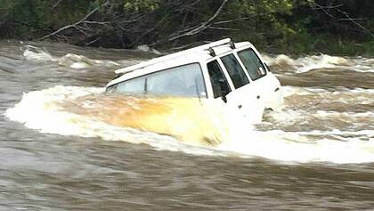 Car stranded in floodwaters at Moruya. 
