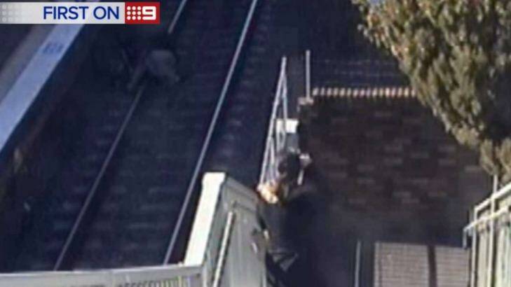 A 62-year-old man rushed onto the tracks at Wentworthville train station after his granddaughters pram fell onto the tracks. Photo: Nine News