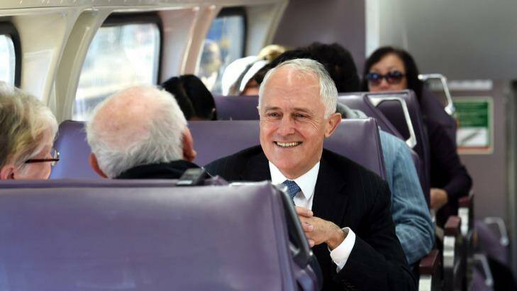Prime Minister, Malcolm Turnbull, pictured here on a train in Sydney's west, has announced a "City Deal" for the region. Photo: Tracey Nearmy
