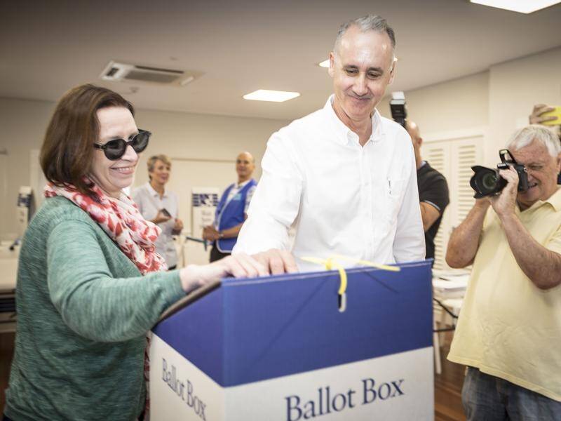David Honey, voting with his wife Robyn, has easily retained Cottelsoe for the WA Liberals.