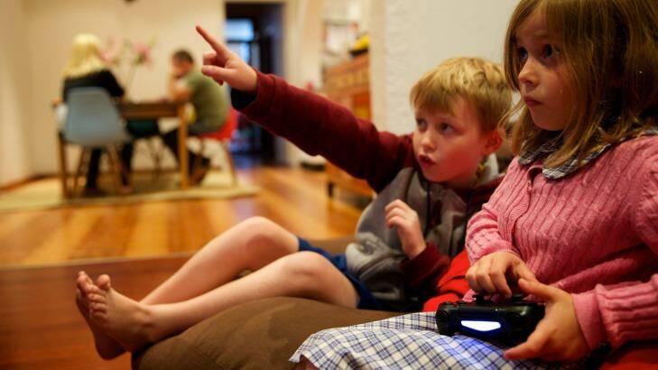 Engaged: Liam Hunter, 9 and Eve Hunter, 6, play Minecraft at their Leichhardt home. Photo: Wolter Peeters