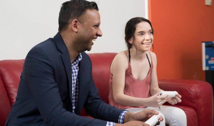 Candice Murphy and her doctor, Dr. Shannon Thomas play Wii in the games room of Ronald McDonald House in Randwick Sydney on Wednesday, September 13 2017. Photo by Cole Bennetts