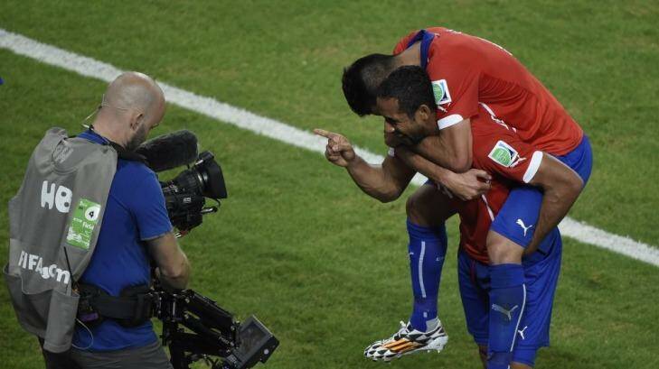 Chile's midfielder Jean Beausejour  celebrates after scoring his team's third goal against Australia.    Photo: Juan Barreto