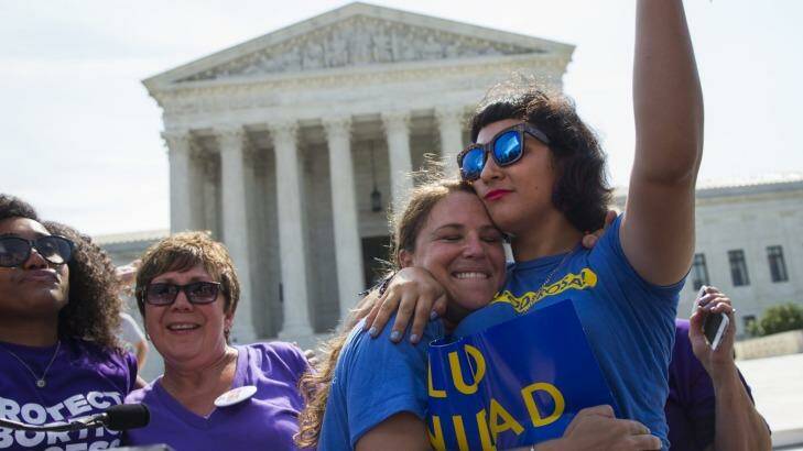 Bethany Van Kampen (left) hugs Alejandra Pablus as they celebrate during a rally at the Supreme Court in Washington  after the court struck down Texas' widely replicated regulation of abortion clinics.  Photo: Evan Vucci