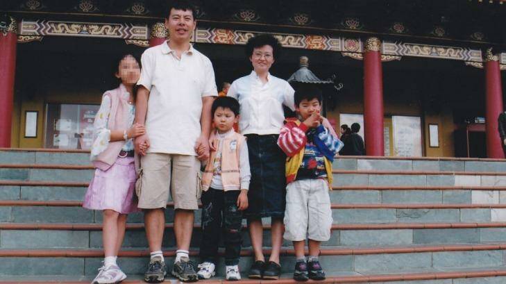 Brenda Lin (pixelated) with her family who were murdered in their Epping home. Photo: Supplied