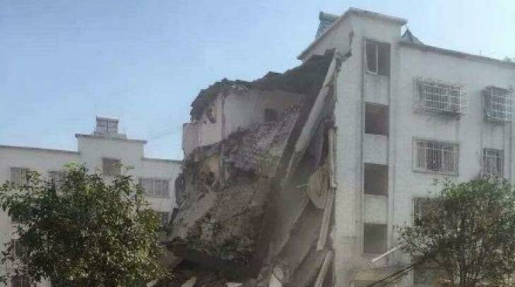 The remains of a government building destroyed by a suspected parcel bomb in Liucheng County, southern China. It was one of 13 targets hit, according to China's official news agency, Xinhua. Photo: Weibo