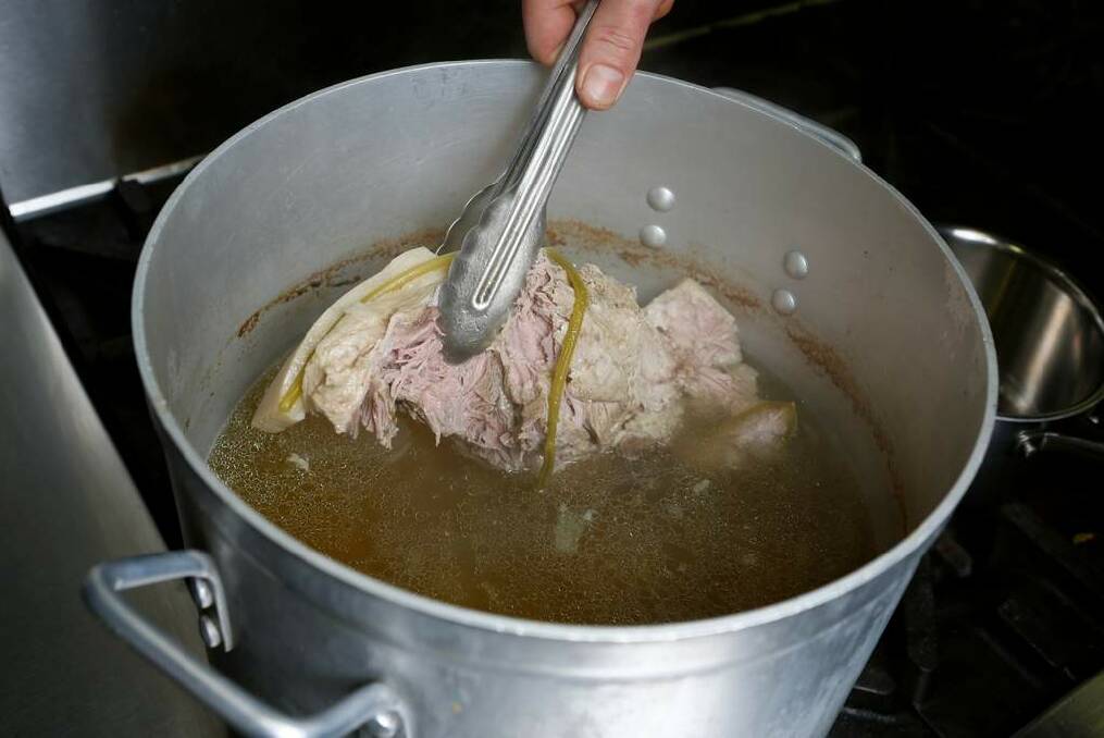 Cook the pork in a large stock pot. Photo: Eddie Jim