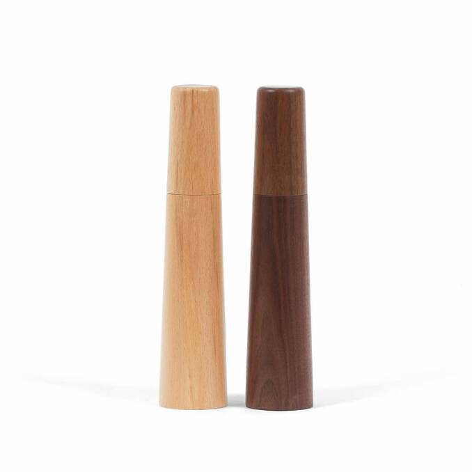 Mill No.2 salt and pepper shakers in beech and black walnut, $109, sandsmade.com. Photo: Supplied