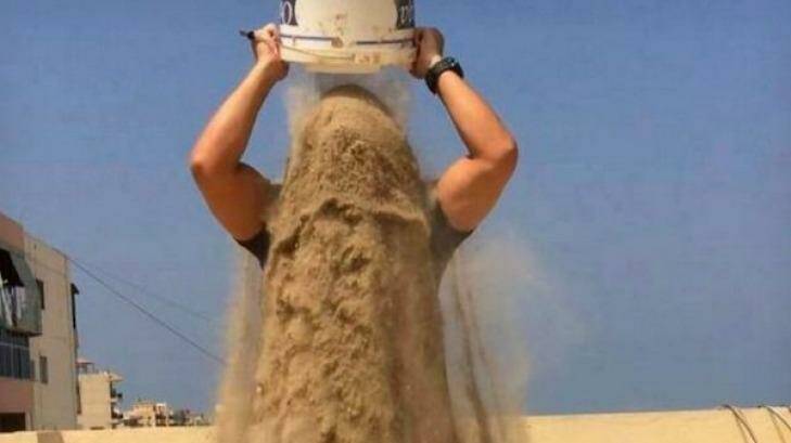 A man raises awareness of the Gaza conflict by taking the 'rubble bucket challenge'. Photo: Twitter