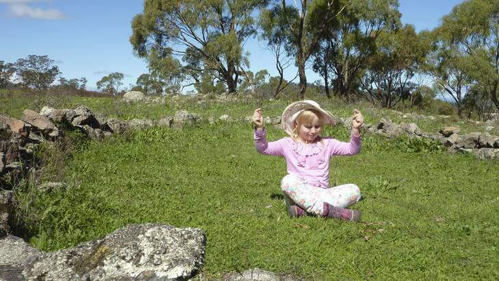 Sarah chills out in Garran's mystery stone circle. Photo: Tim the Yowie Man