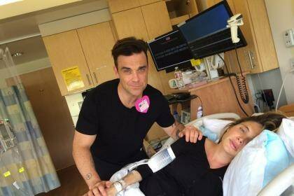 Robbie Williams and his wife, Ayda Field, during her 14-hour birth with their second child.