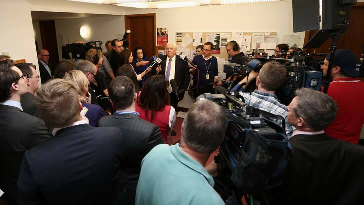 Clive Palmer holds a press conference in the Parliament House press gallery on Monday. Photo: Alex Ellinghausen