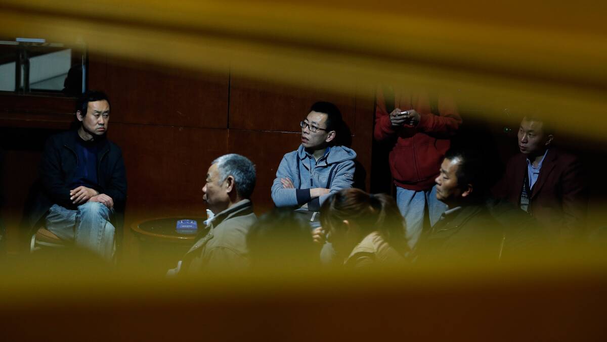 Chinese relatives of the passengers onboard Malaysia Airlines flight MH370 wait for the latest information at Lido Hotel on March 20, 2014 in Beijing, China. Australian Prime Minister, Tony Abbott said that authorities have spotted two objects in the Indian Ocean that may be related to flight MH370. 