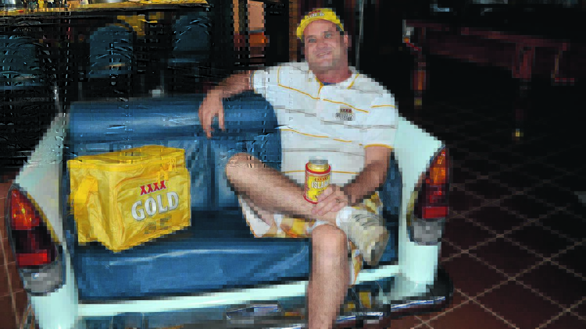 GOLDEN GIG: Lindsay Flack sits on the “car chair” he made a few years ago. Because of his ingenuity he is now an official XXXX Gold ambassador, working as a Spanner and Thongs Academy Dean. 