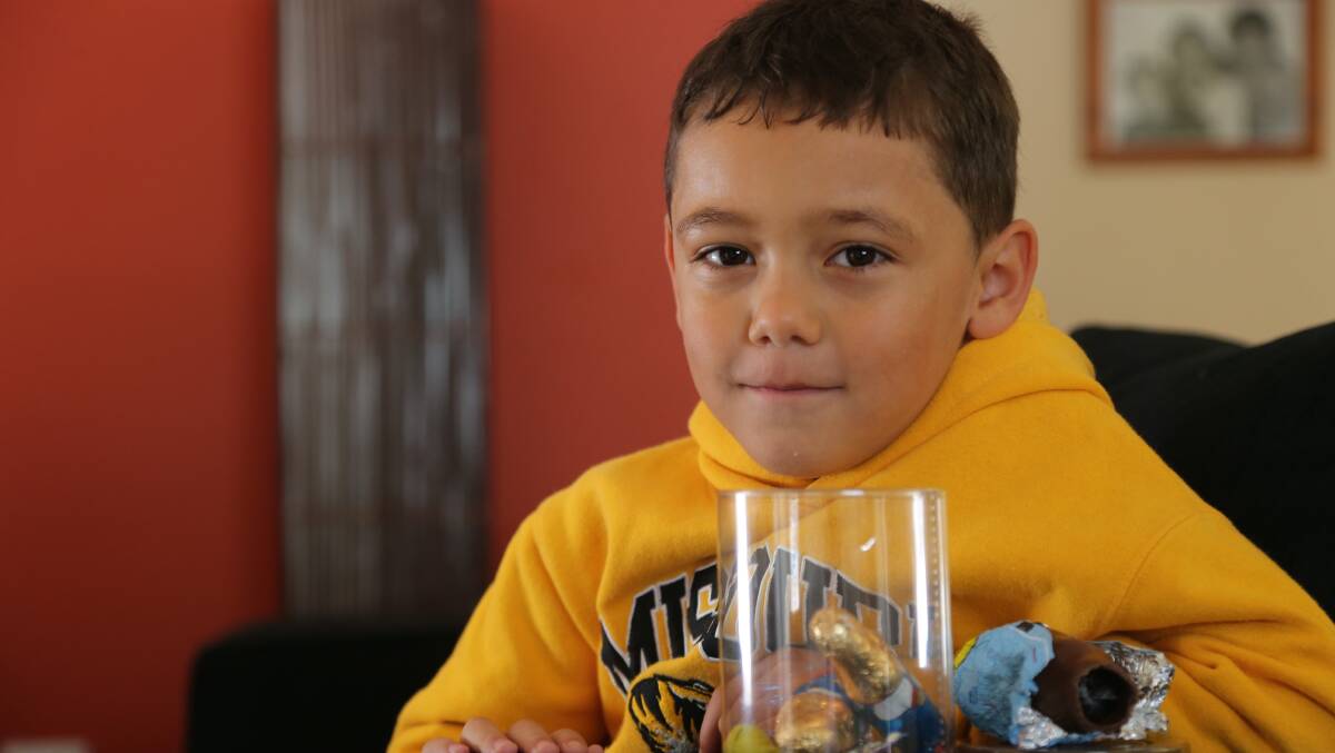 HIDDEN SURPRISE: Six-year-old Jye Eslick got more than he bargained for when he got a mouthful of spider web from inside the Easter egg purchased from Griffith's The Reject Shop. 