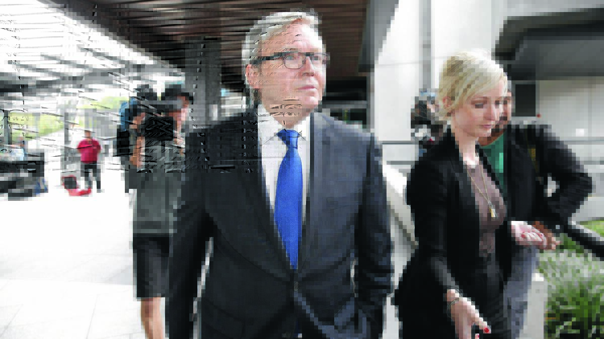 UNDER PRESSURE: Former prime minister Kevin Rudd leaves the Royal Commission at the Brisbane Magistrates Court for a lunch break. 