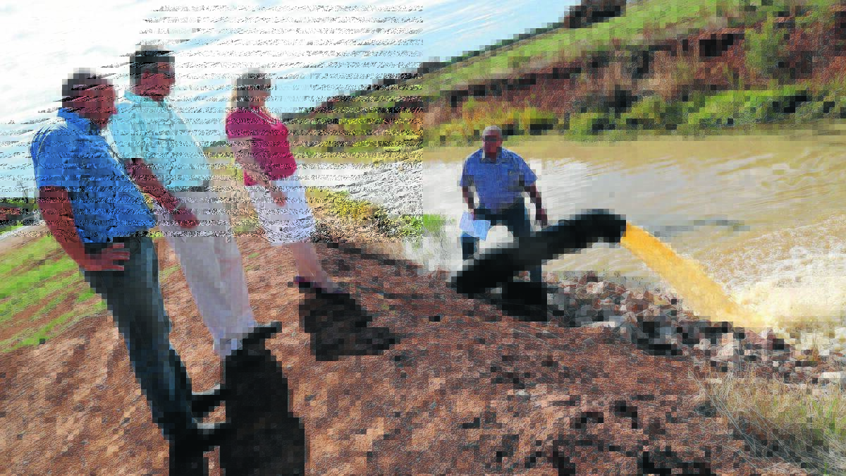 UP AND RUNNING: Councillor Simon Croce, Yoogali resident Michael Fisher, councillor Anne Napoli and mayor John Dal Broi oversee the pilot run of the new pump at Yoogali on Wednesday. 