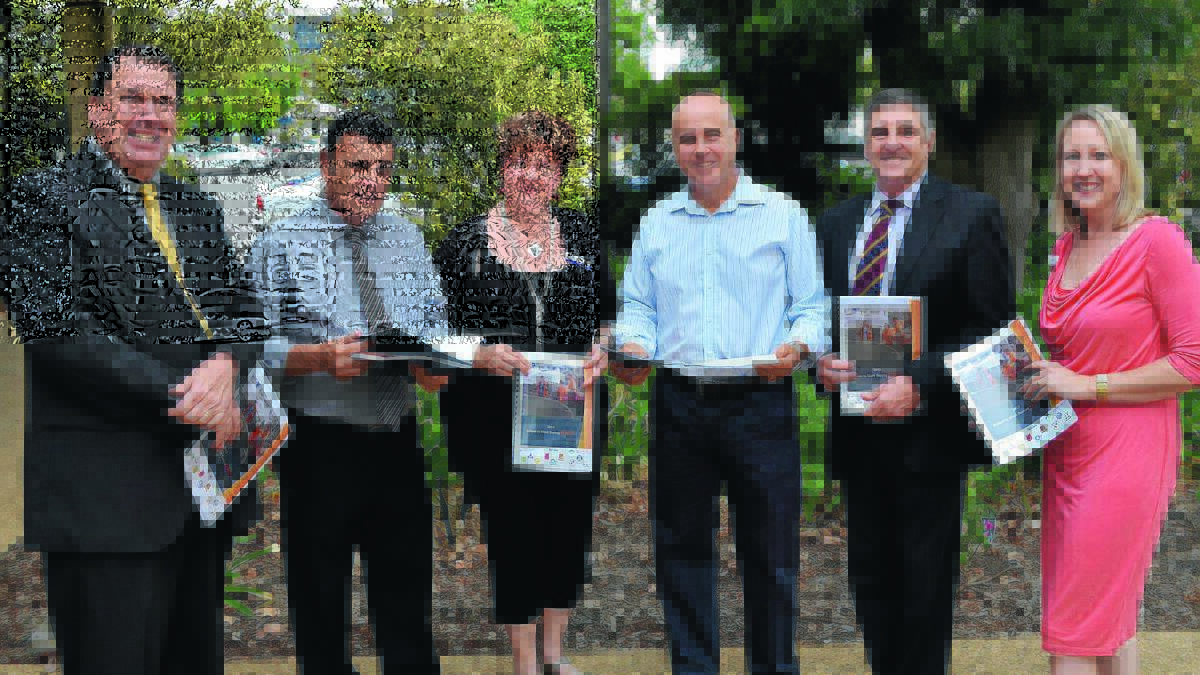 SCHOOLS SURVEY: Leeton shire economic, tourism and events manager Peter Kennedy, Griffith High School principal Charlie Cochrane, Getset survey conductor Jeanine Bird, minister for education Adrian Piccoli, Marian High School principal Alan Le Brocque and council economic development and tourism officer Nicola James with the new youth survey for the region. 