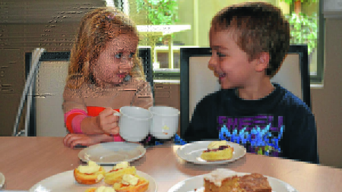 TEA TOTS: Eva Edgcome-Lucas, 3, and Rylan Scarfo, 5, enjoy Griffith’s Biggest Morning Tea on Friday at the Exies.  