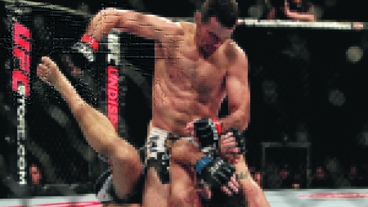 KING OF THE CAGE: Australian UFC star Anthony Perosh, pictured here on his way to a win over Canada’s Nick Penner back in March 2012, will commence his affiliation with RMA & Total Fitness this weekend by holding a Brazilian jiu-jitsu seminar. 