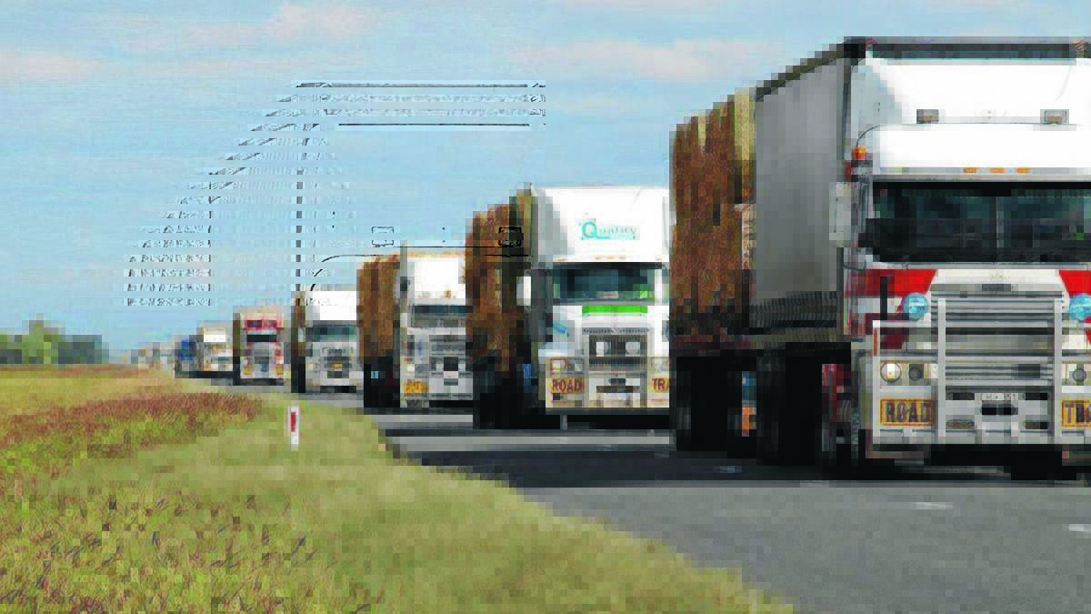 HELP ON THE WAY: The convoy of trucks on the road to Bourke is a sight to see. 				          Picture: Facebook 