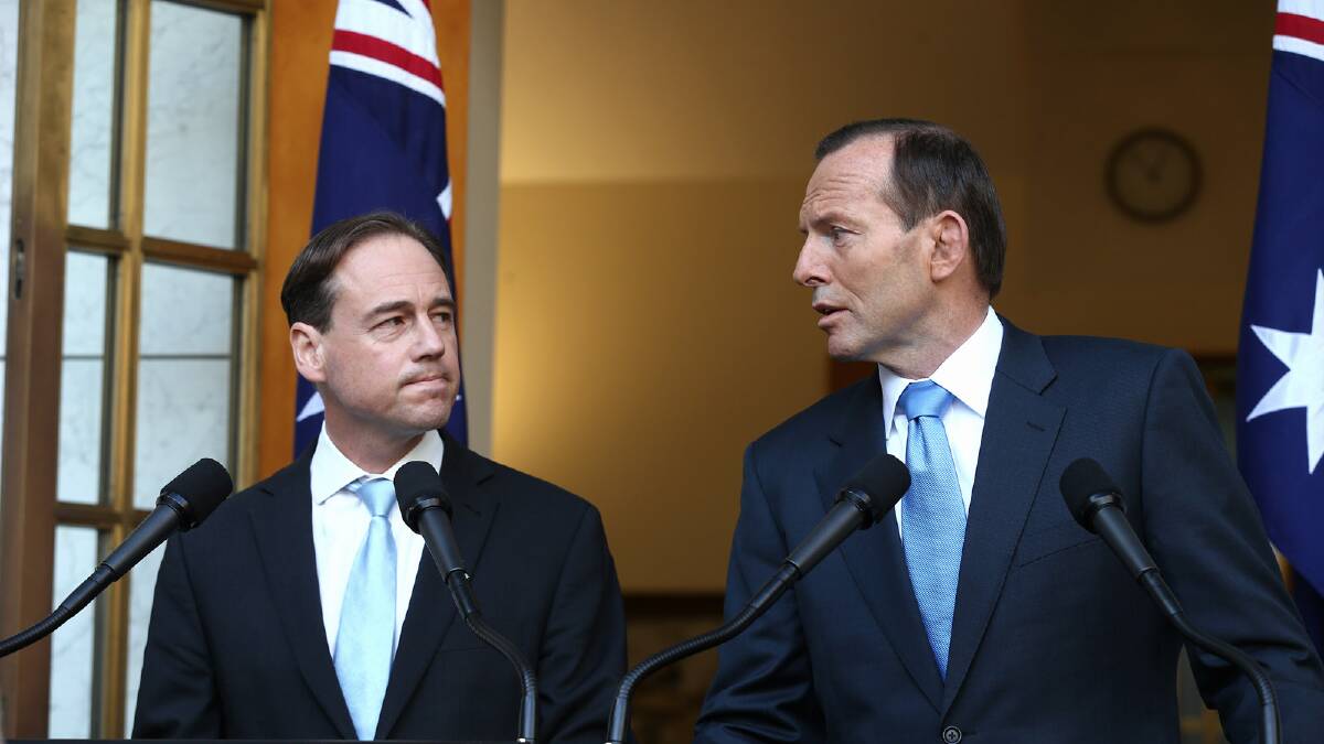 Environment Minister Greg Hunt and Prime Minister Tony Abbott at Parliament House after the carbon tax repeal was approved. Picture: FDC