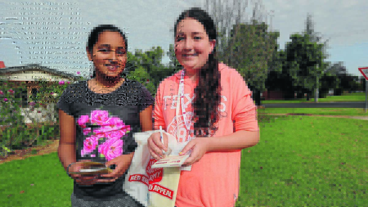 DUO STEPS UP: Japleen Kaur, 12, and Kate Simpson, 13, are happy to help collect donations for the annual Red Shield Appeal. Picture: Anthony Stipo