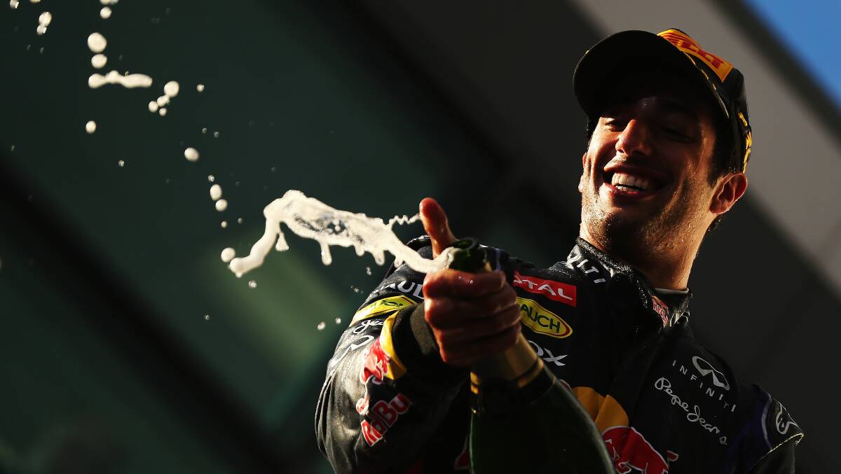 Daniel Ricciardo of Australia and Infiniti Red Bull Racing celebrates on the podium after finishing second. PHOTOS: GETTY IMAGES